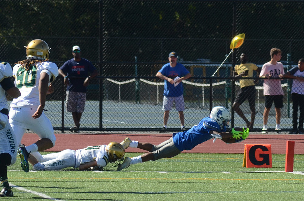 Valley Central’s Elijah Bellinger dives toward the goal-line as FDR’s Aidyn VanSteenburg tries to make the tackle during Saturday’s Class A football game at FDR High School in Hyde Park.